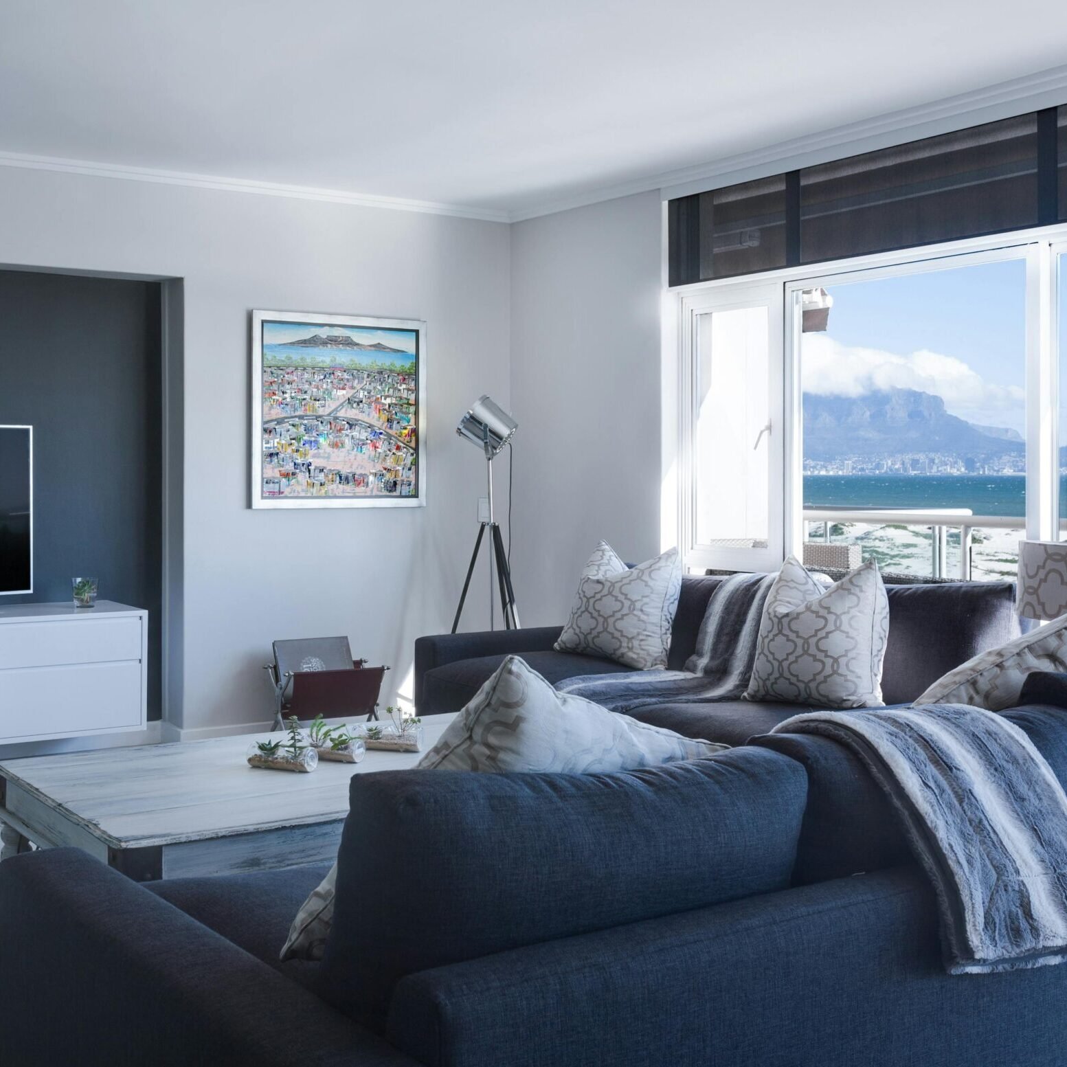 Stylish living room with a view of Table Mountain, blending modern design with natural beauty.